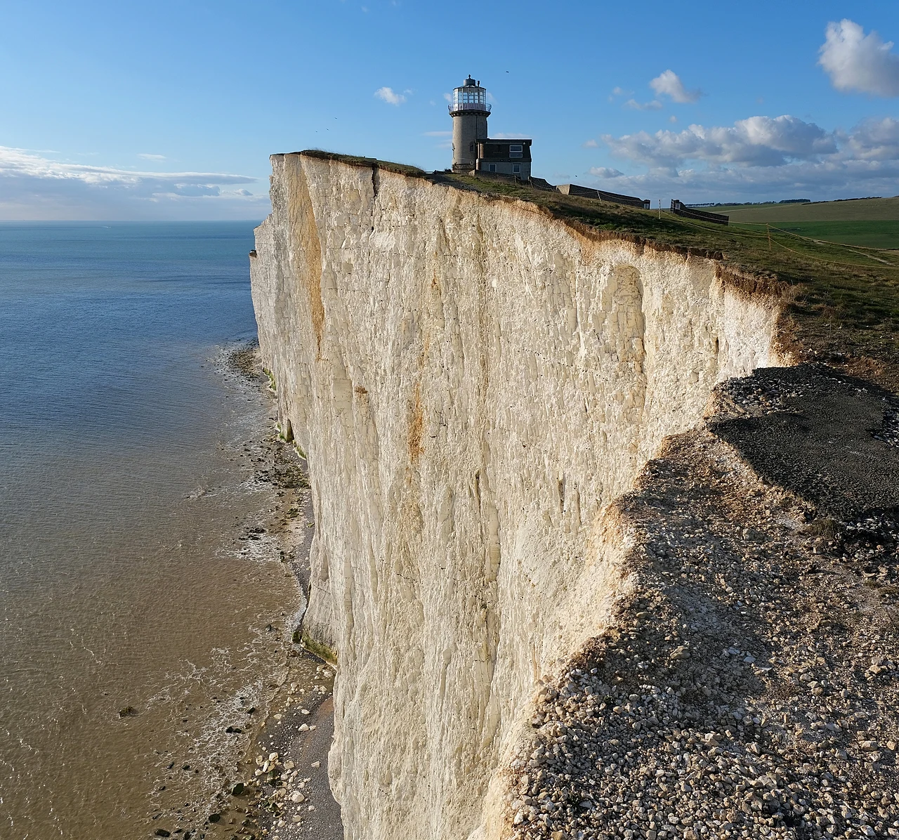 Belle Tout Lighthouse stands above the chalk cliffs of Beachy Head on England’s south coast, overlooking the English Channel.